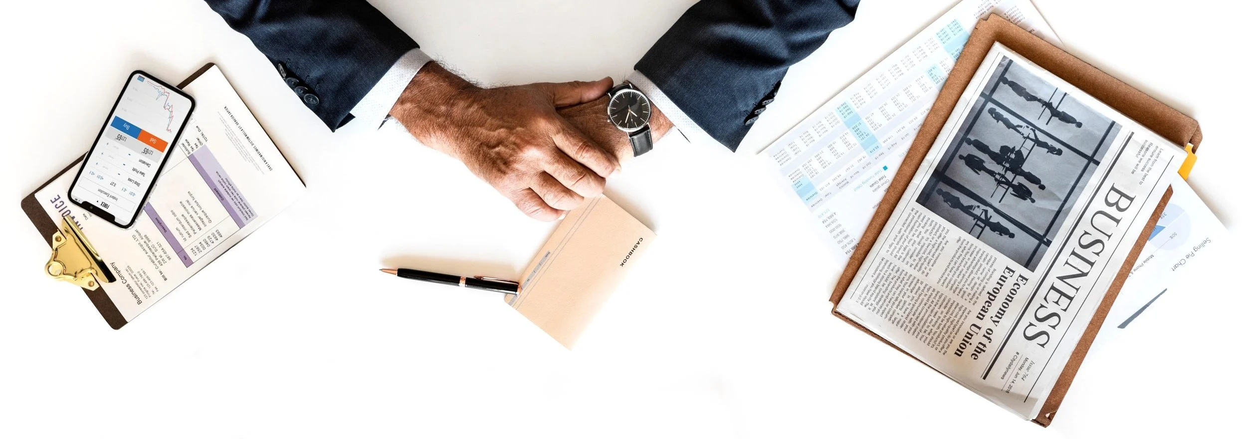 Top view of a businessman and various office items Top view of a businessman and various office items